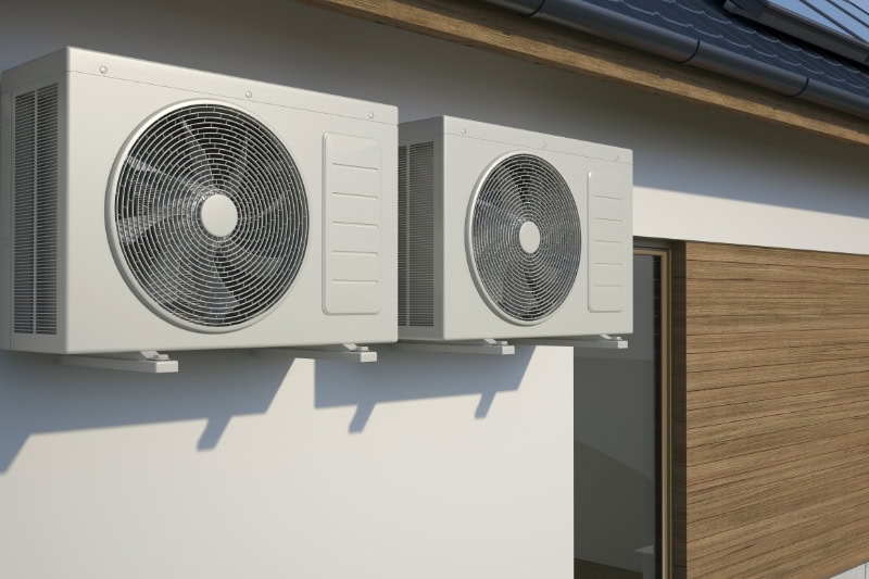 Two outdoor ductless air conditioning systems mounted to home in Grand Junction, Colorado.